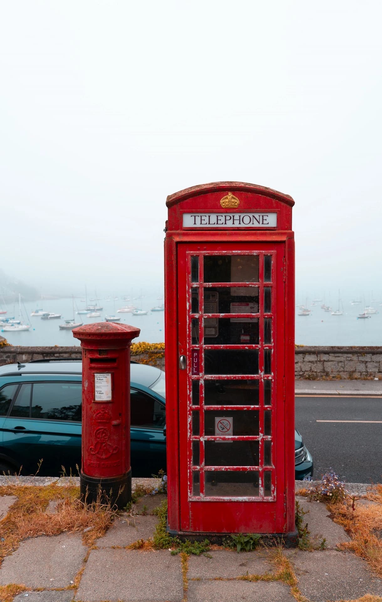 photo of a telephone boot net to a red post box